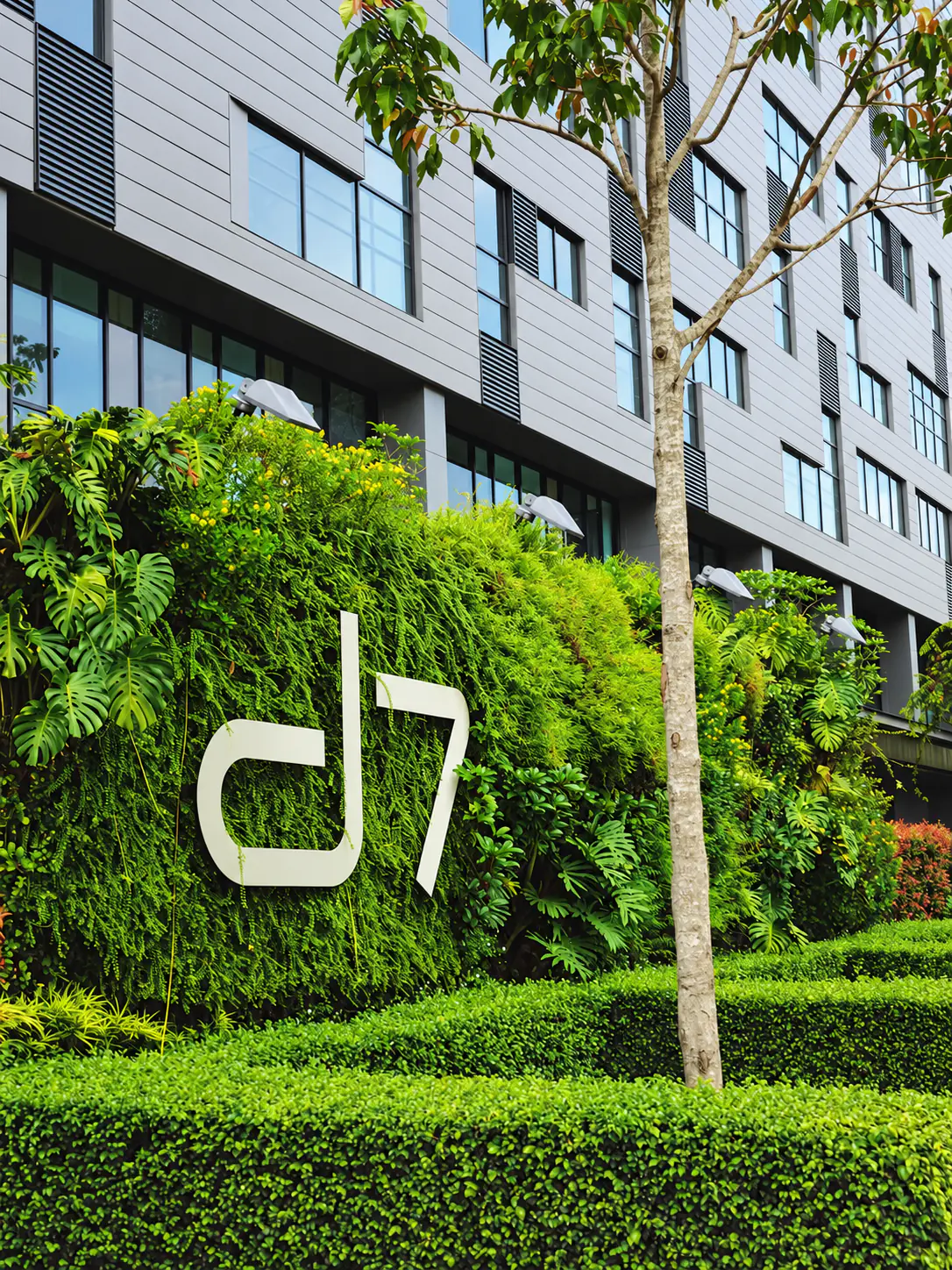 The d7 sign set into a vertical garden at the building entrance